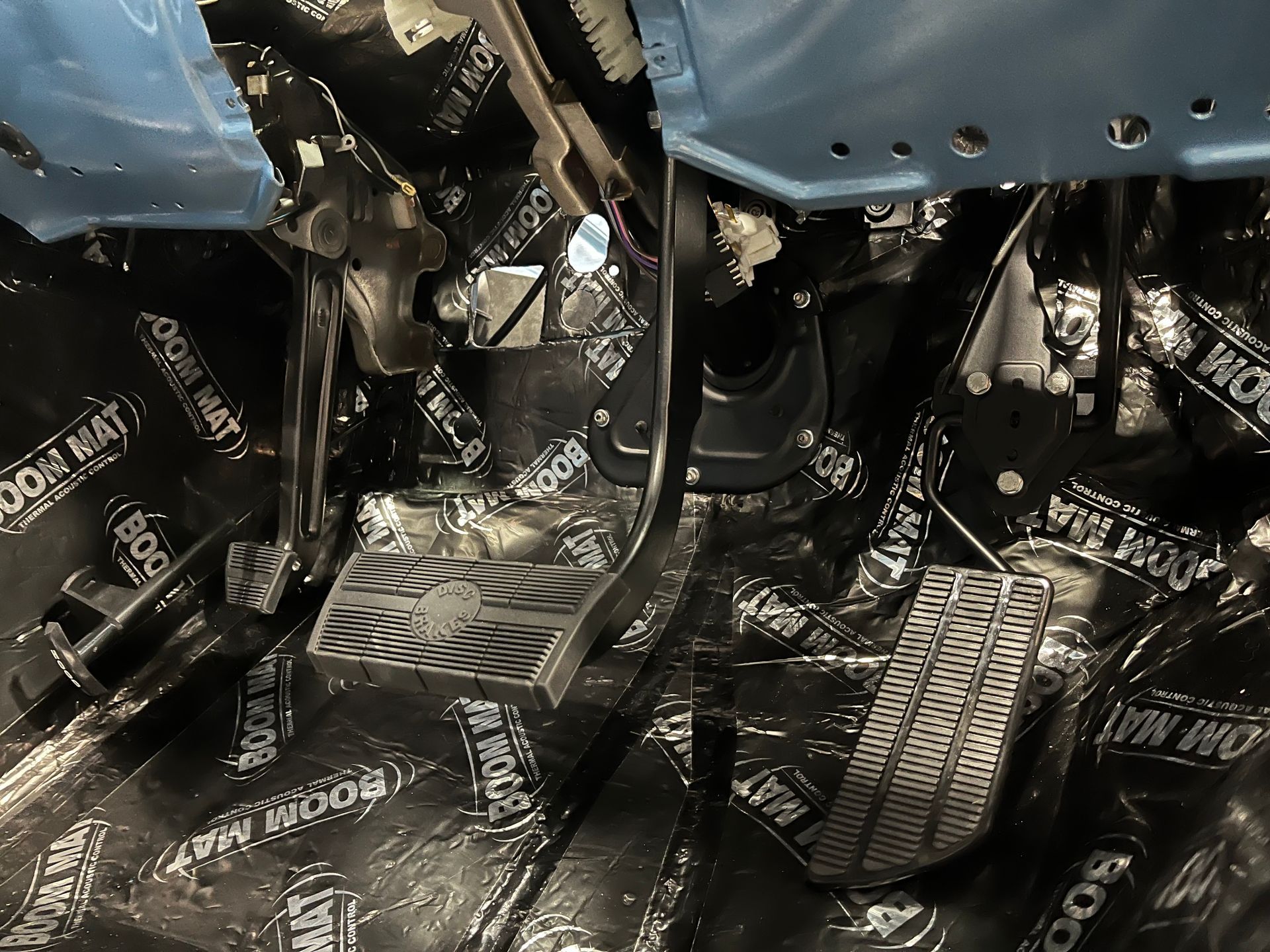 The inside of a car with a lot of foam on the floor