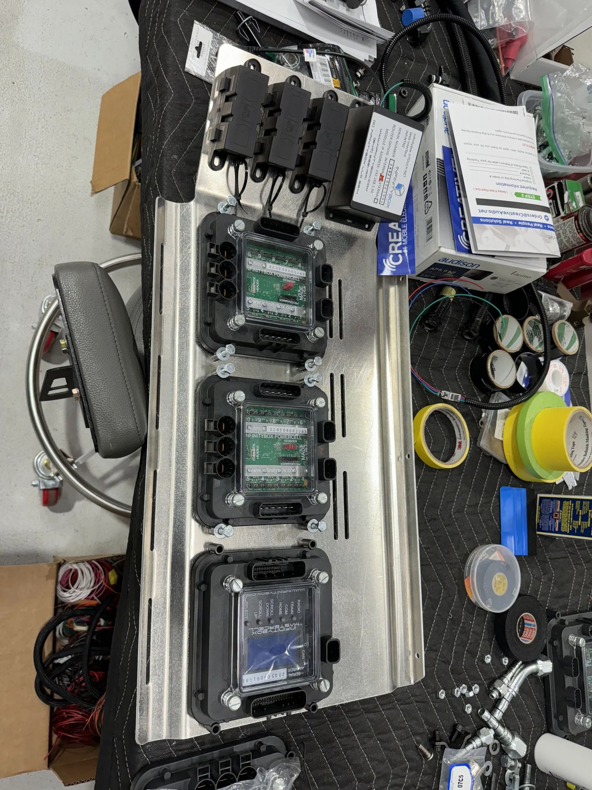 A bunch of electronic components are sitting on top of a table.