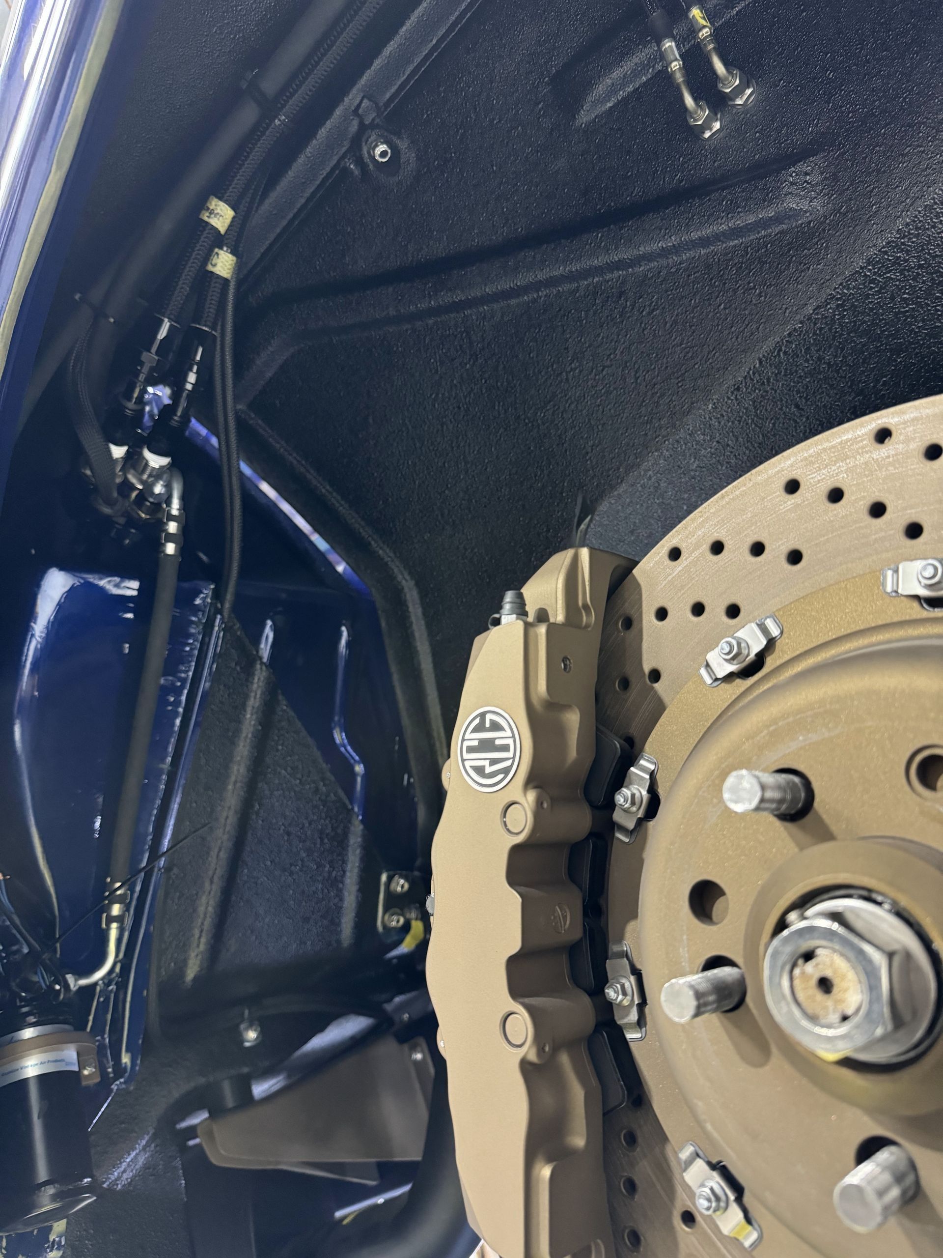 A close up of a brake disc on a car