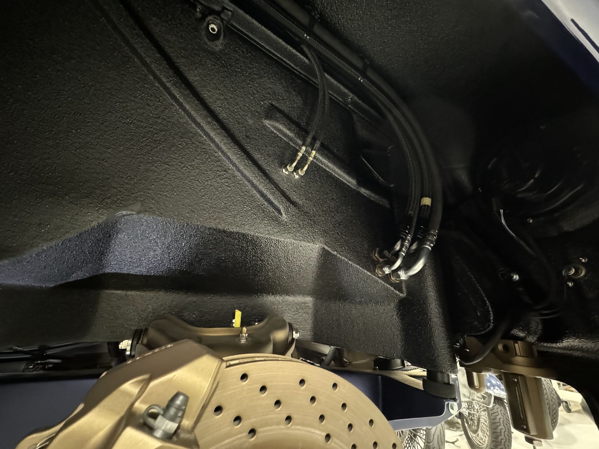 A close up of a brake caliper on a car