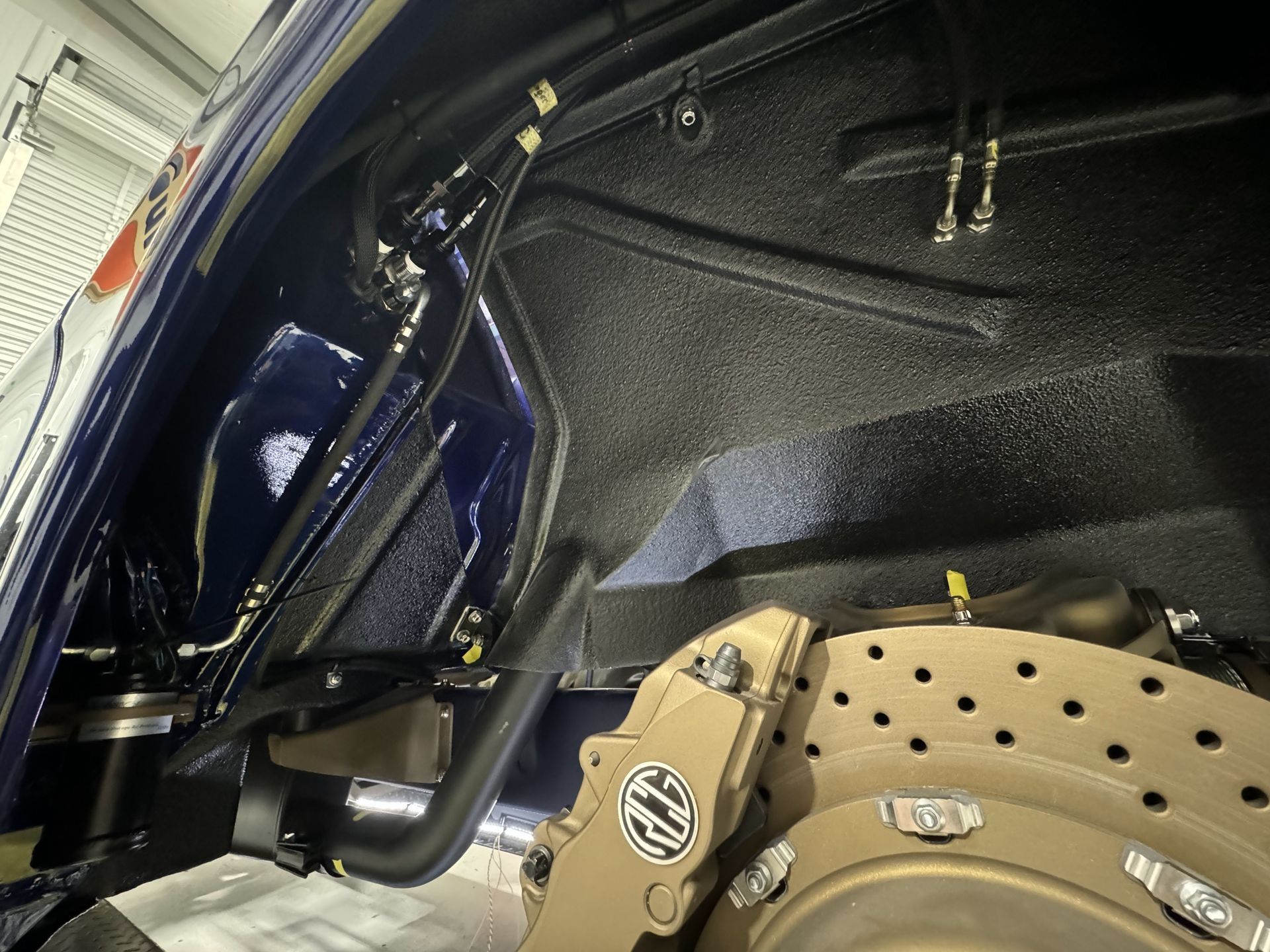 A close up of a brake caliper on a car