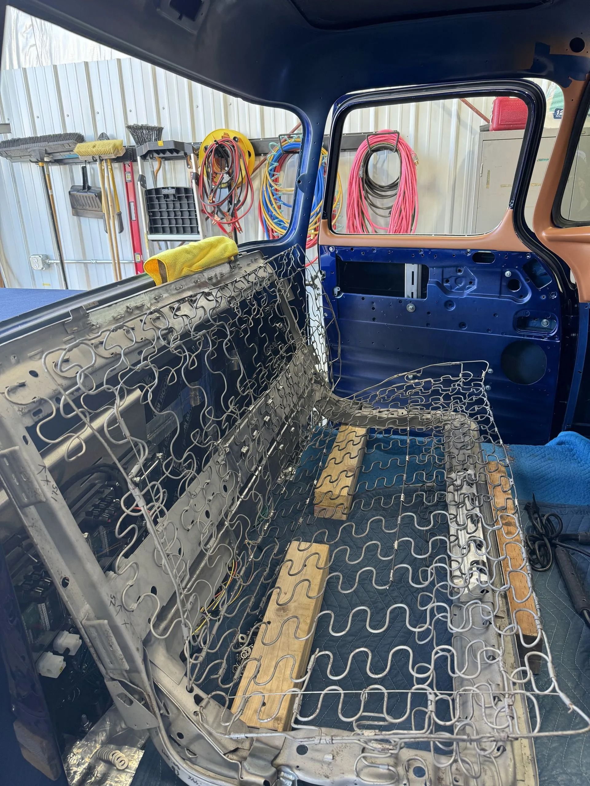 The back seat of a truck is being remodeled.