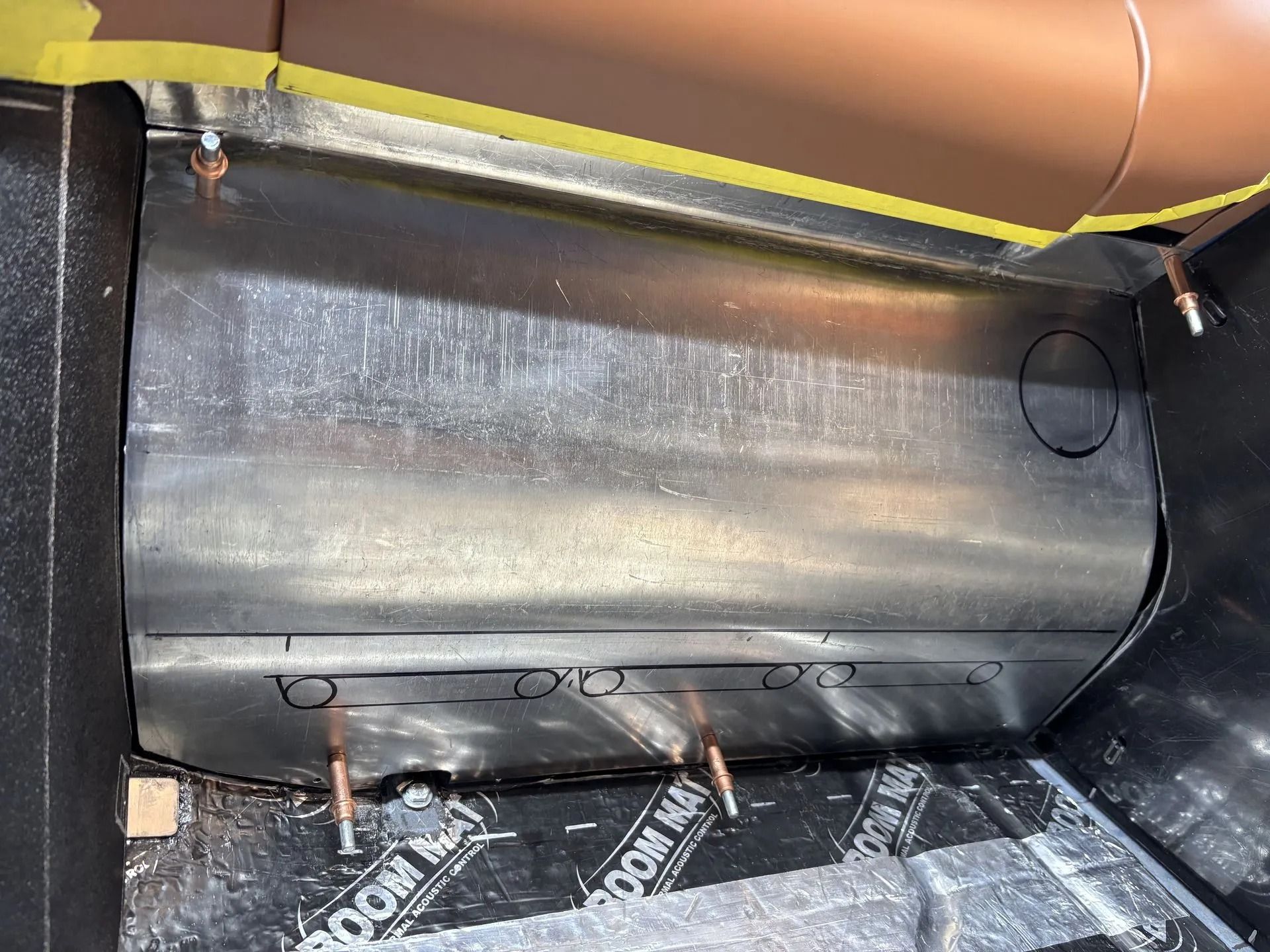 A large metal container is sitting on top of a wooden table.