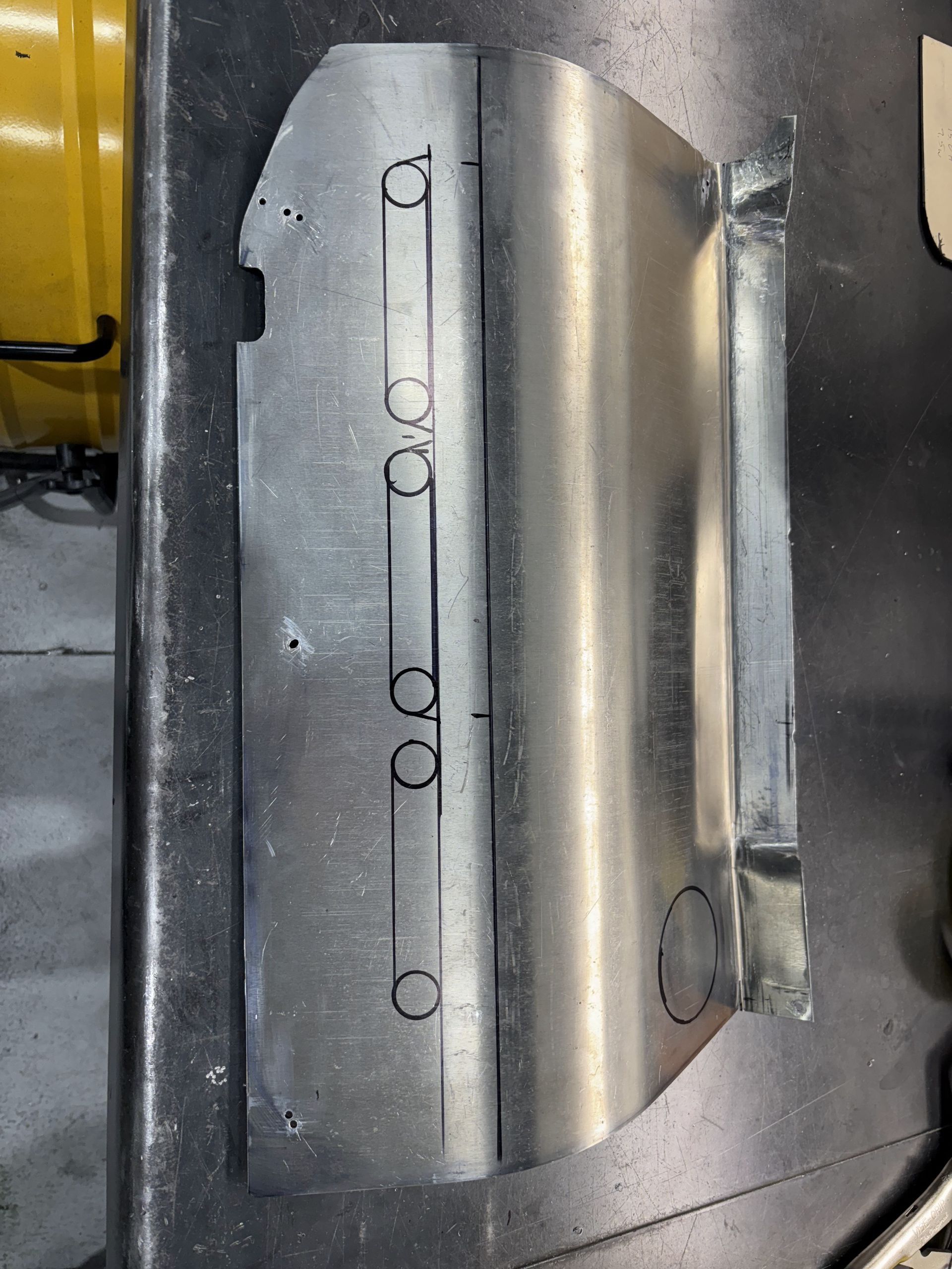 A piece of metal is sitting on top of a table.