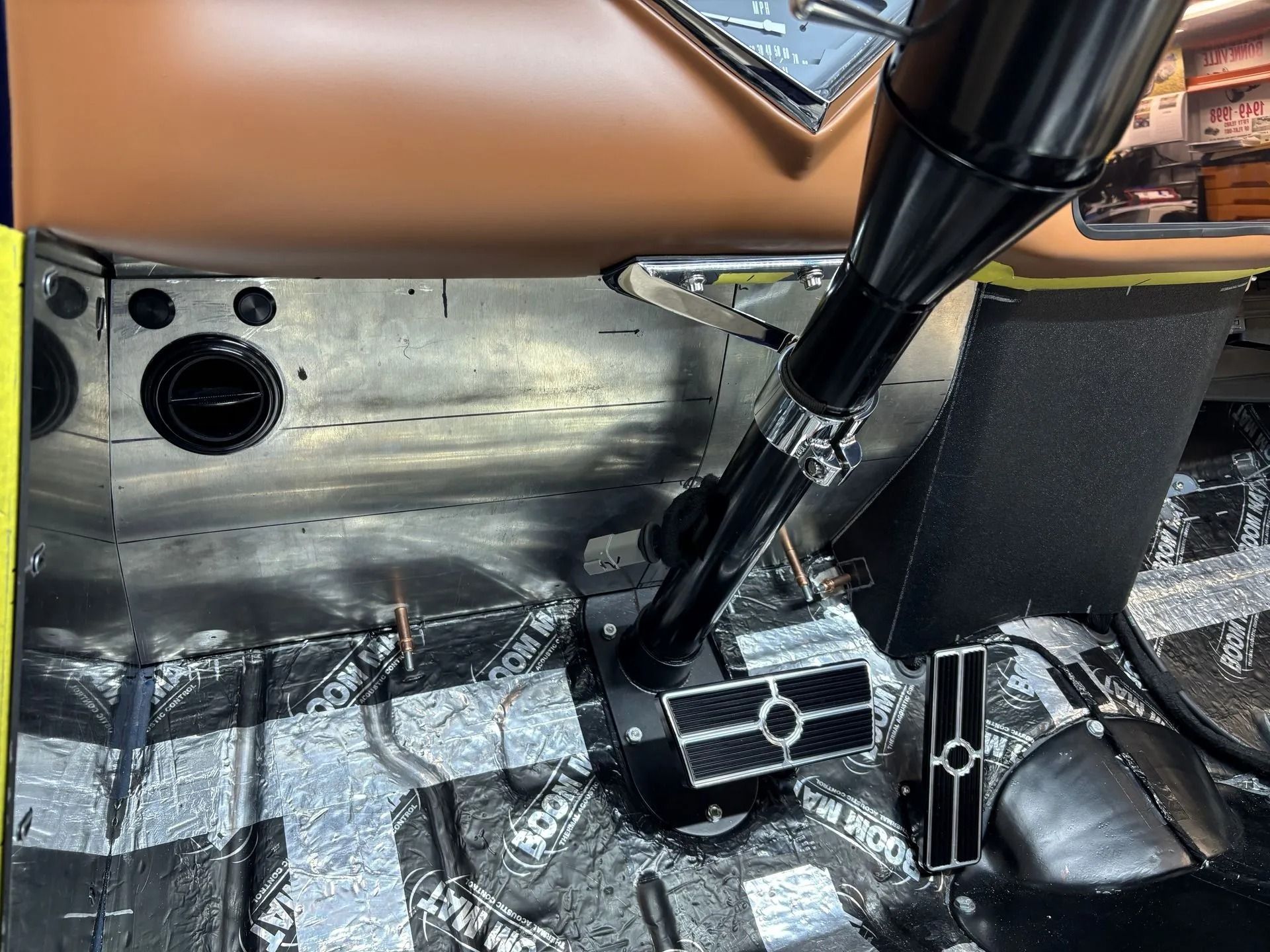 A close up of a steering wheel in a car
