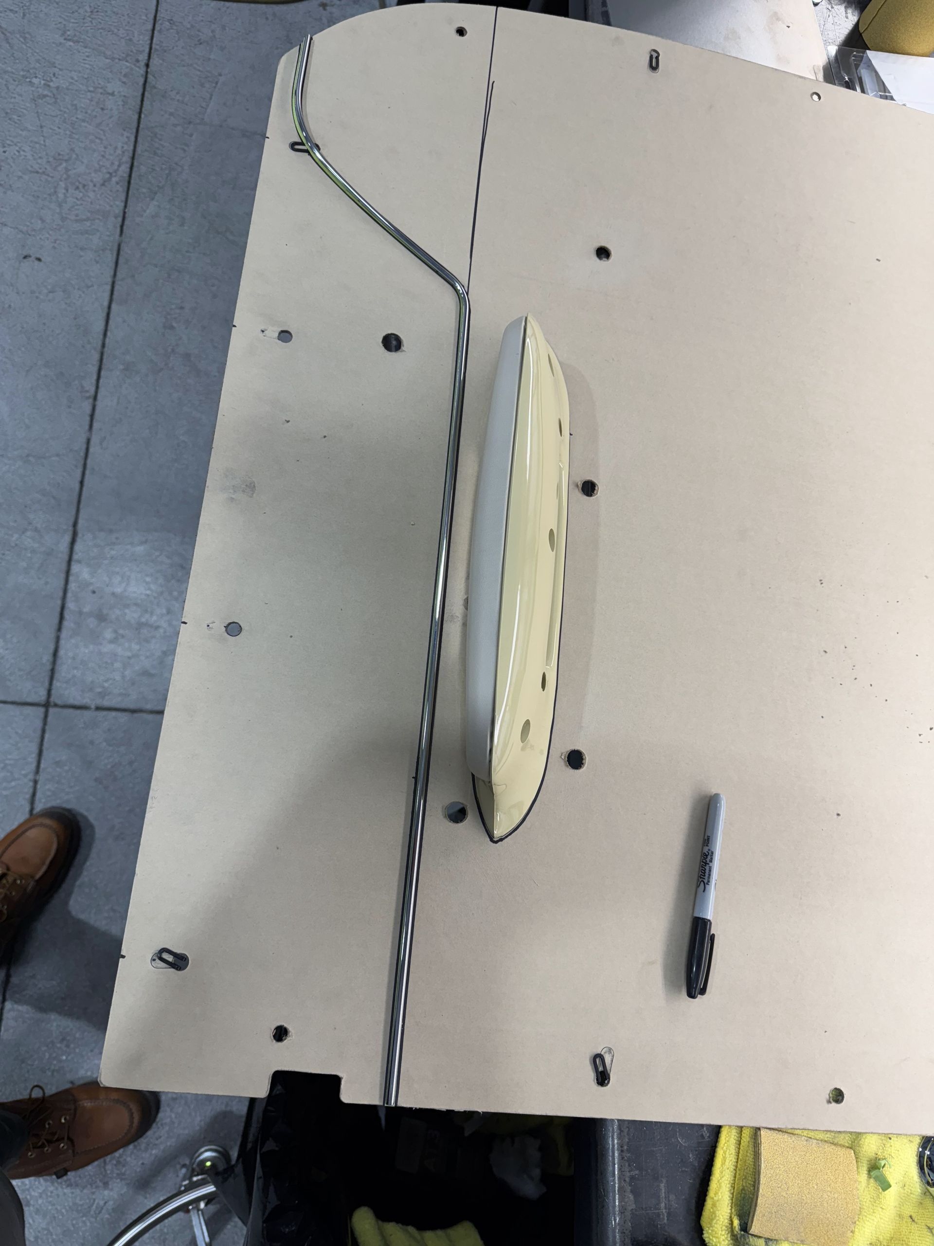 A white table with a clock and a marker on it