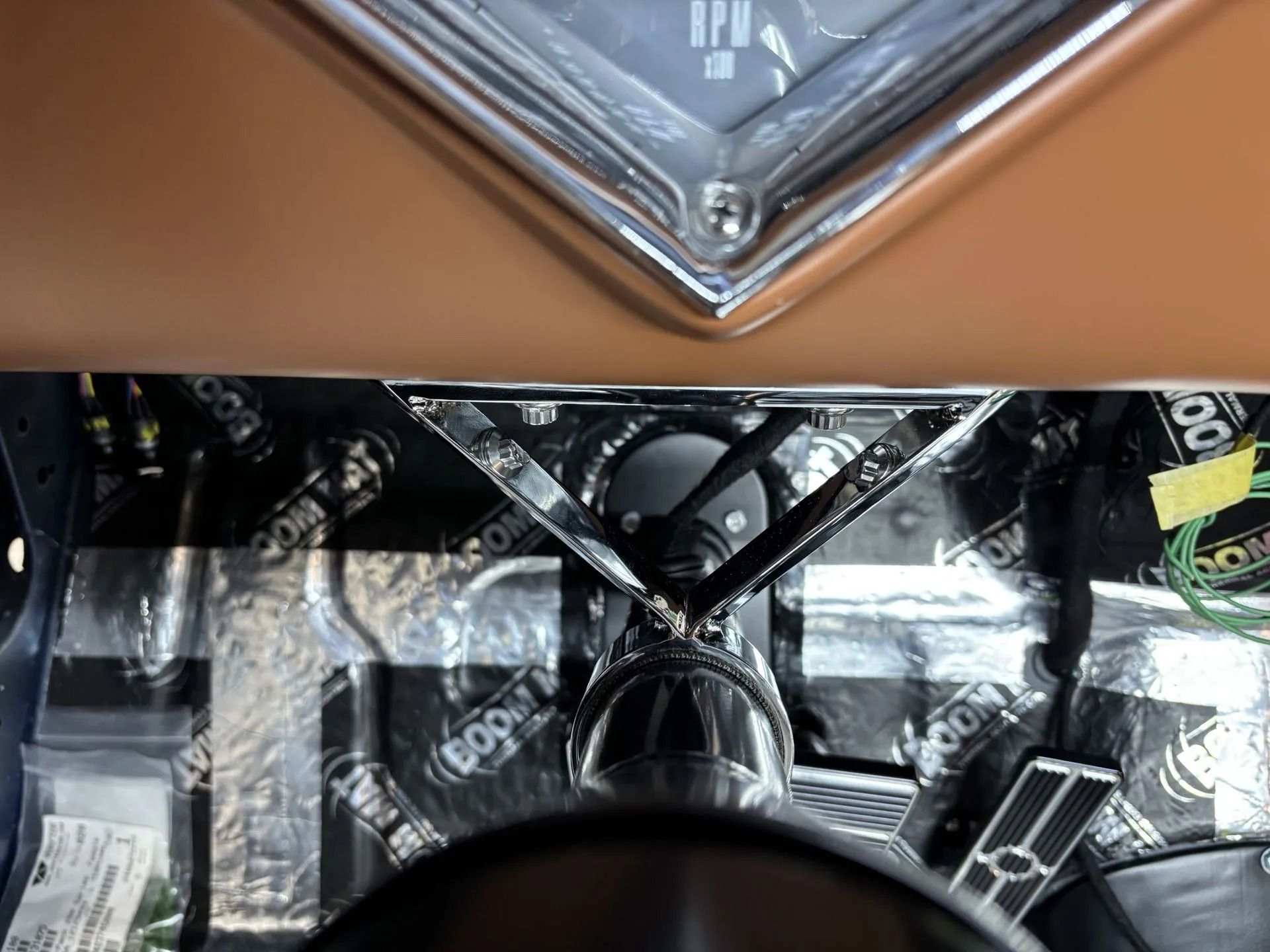 A close up of a car dashboard with a clock on it