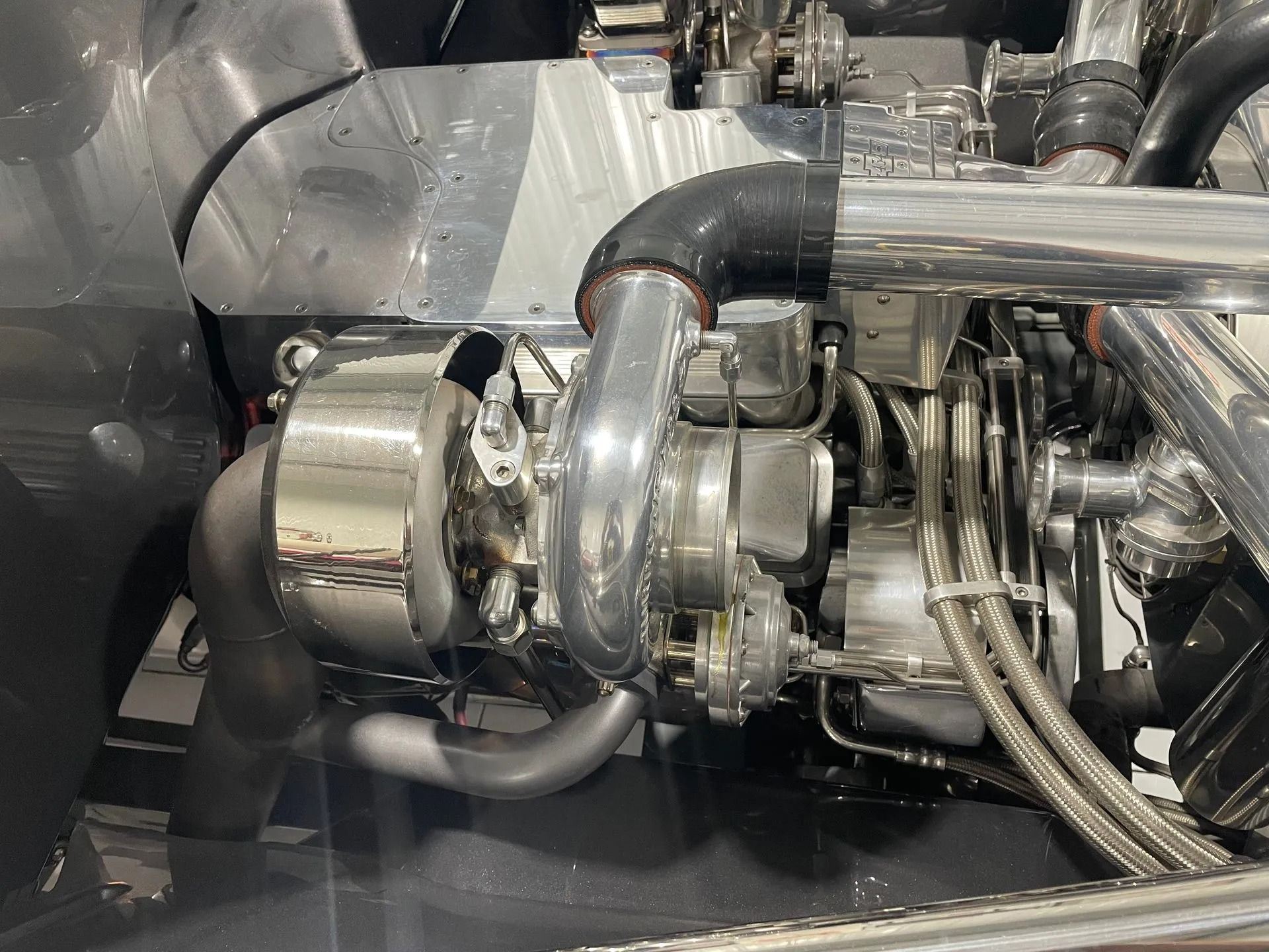 A close up of a car engine with a turbo