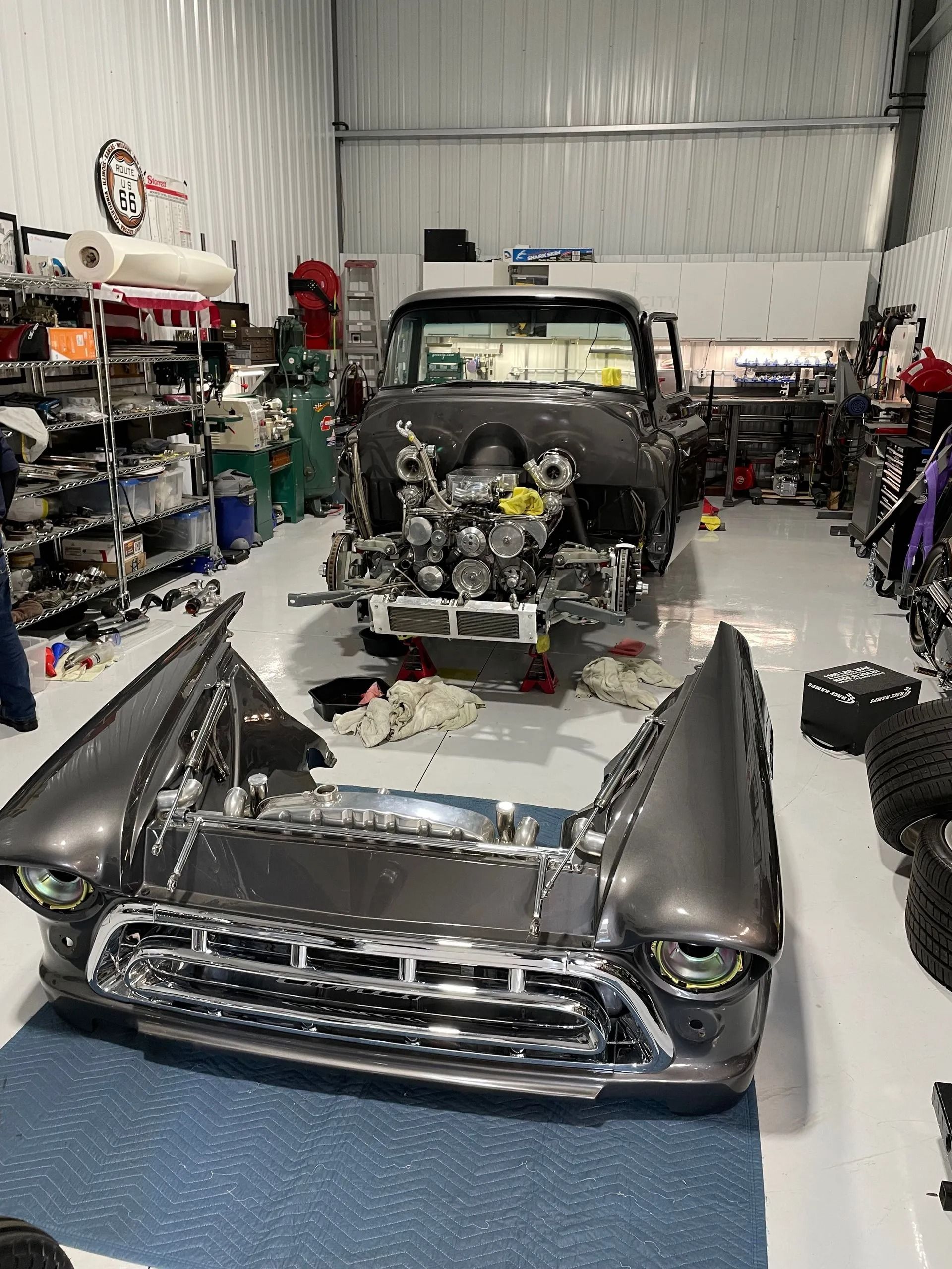 A car is being worked on in a garage.