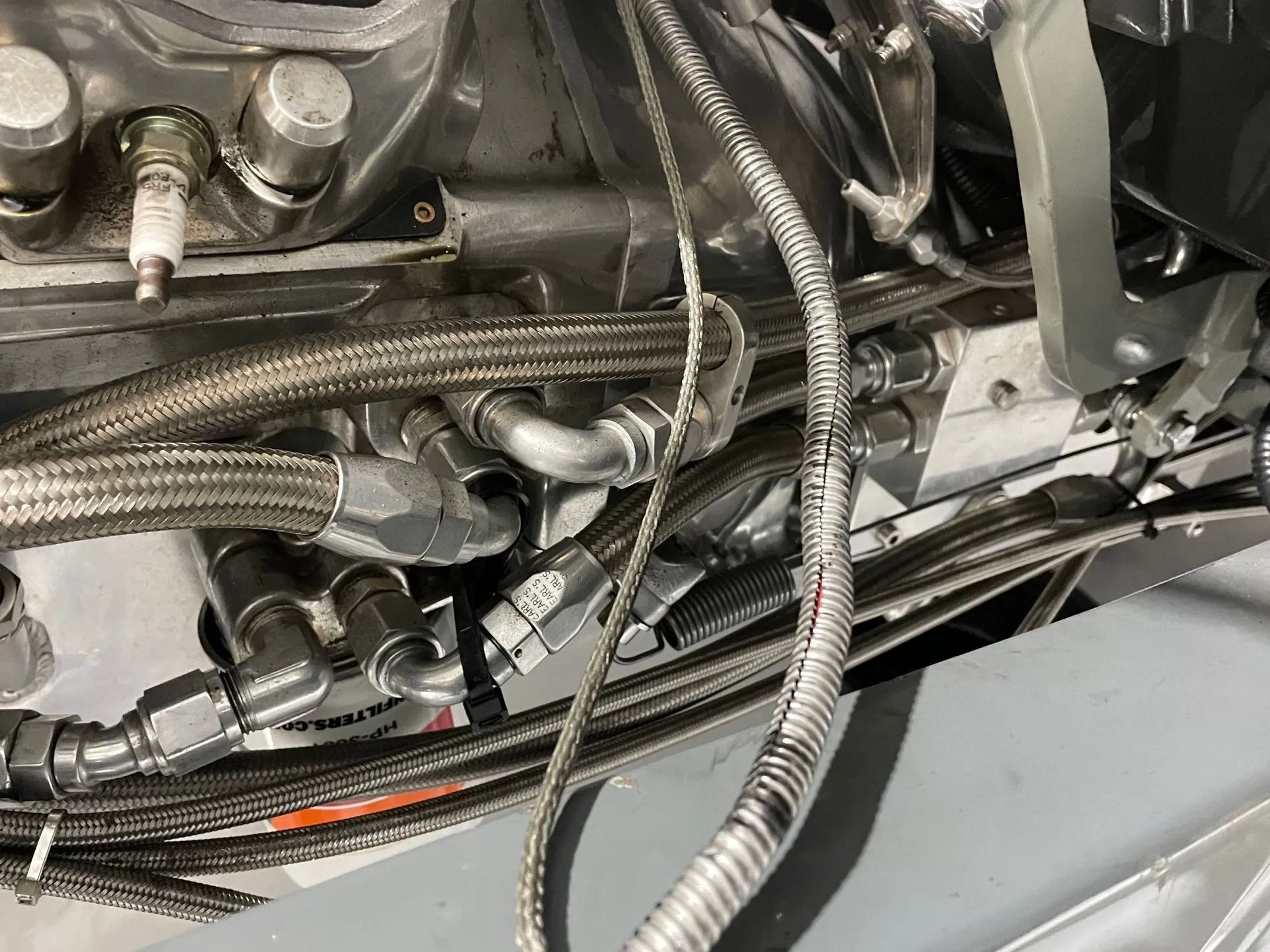 A close up of a hose on a motorcycle engine