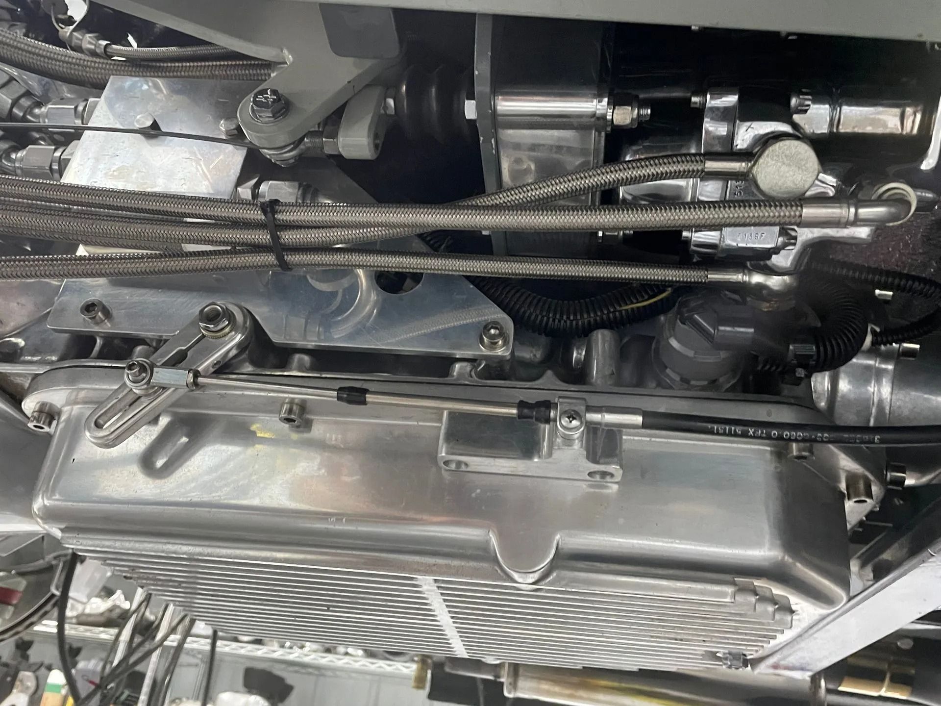 A close up of the underside of a car engine.