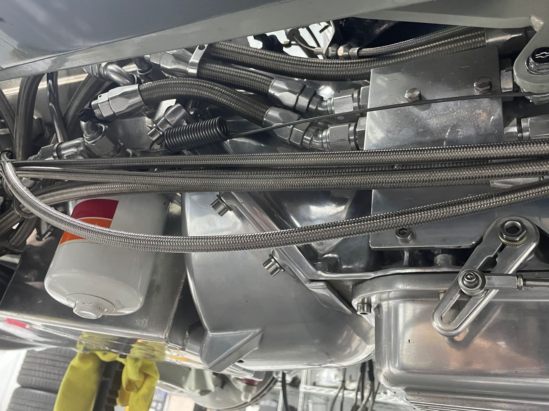 A close up of a car engine with a lot of wires coming out of it