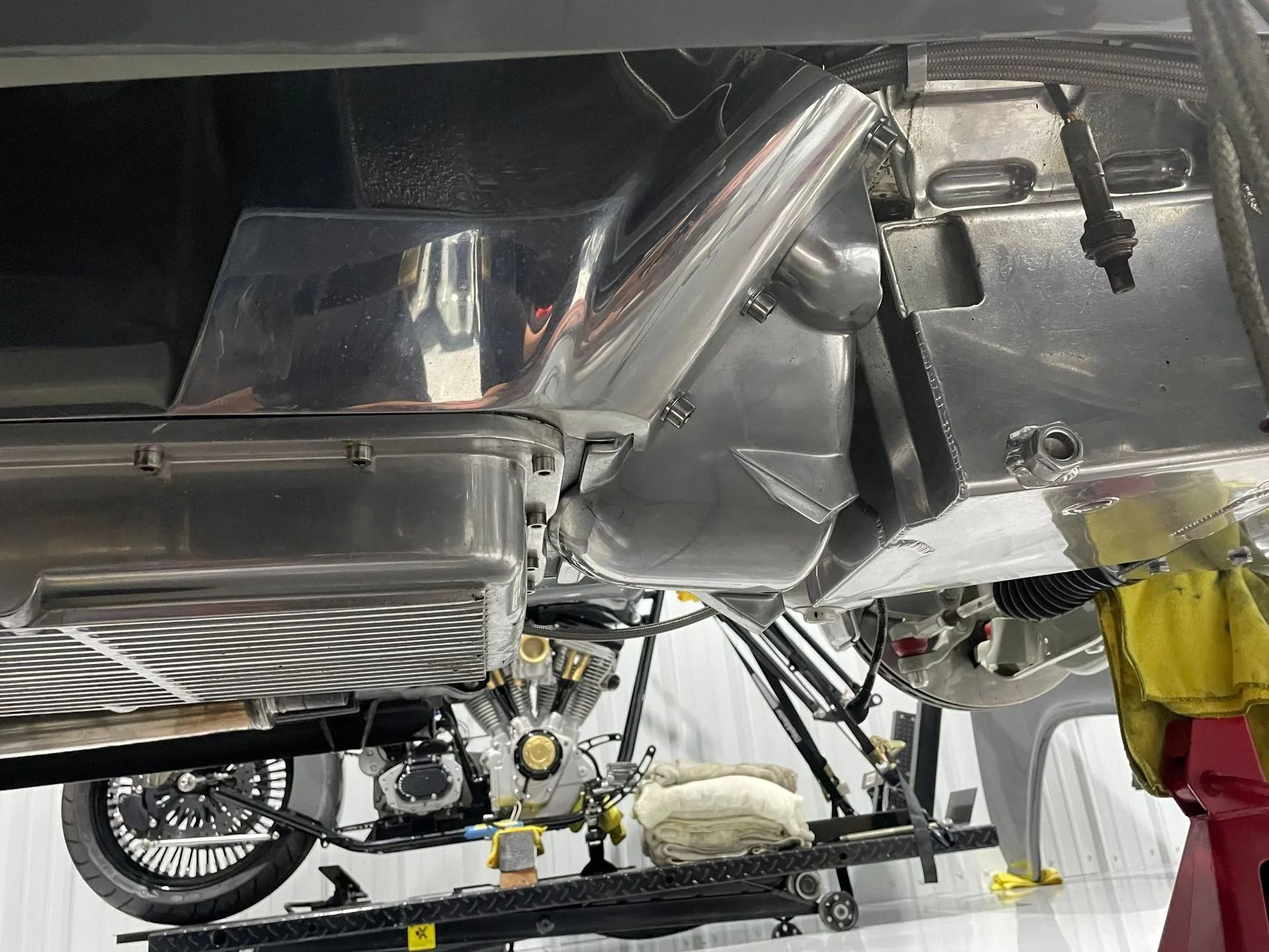 A motorcycle is being worked on in a garage