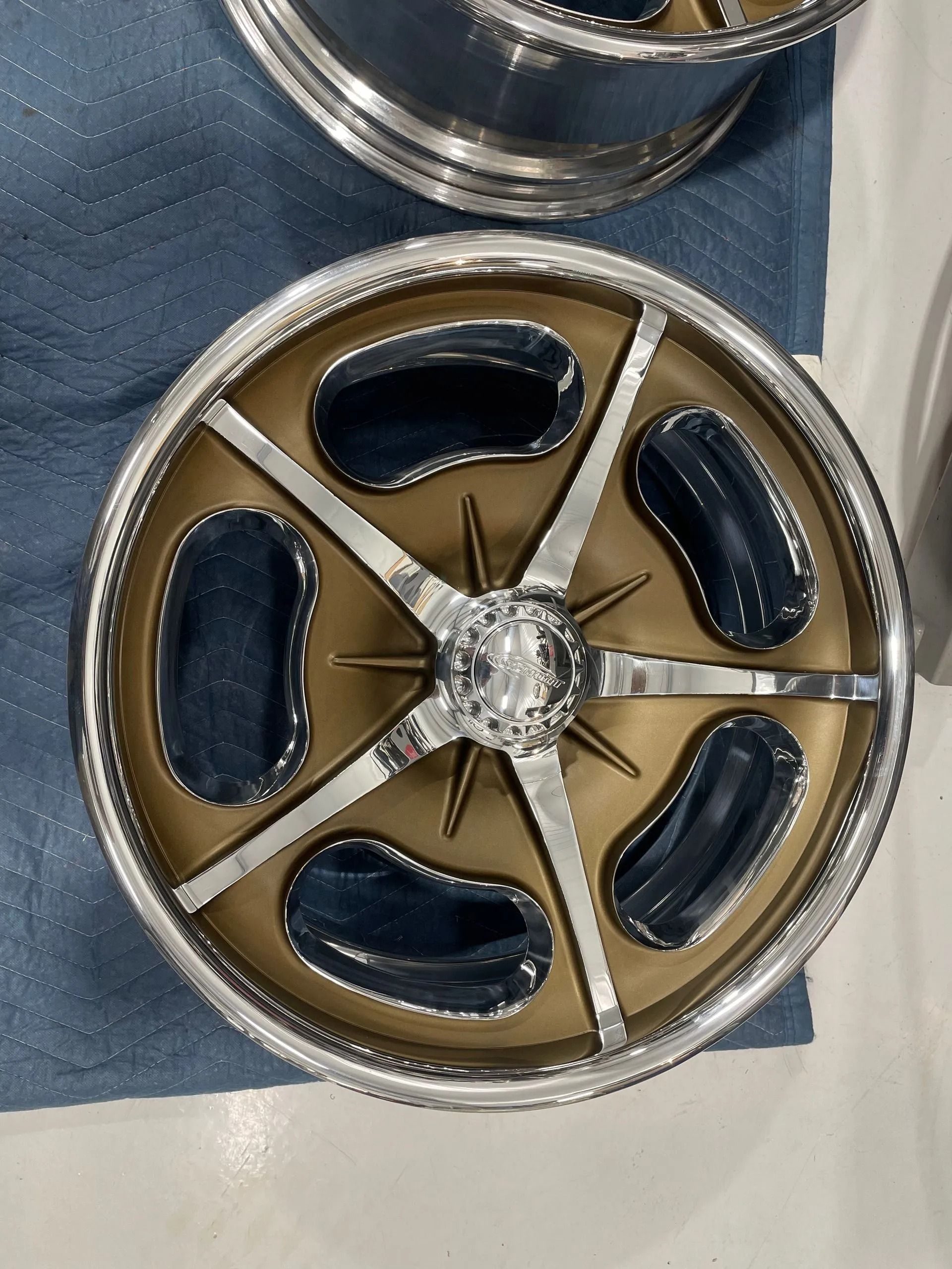 A close up of a wheel with holes in it