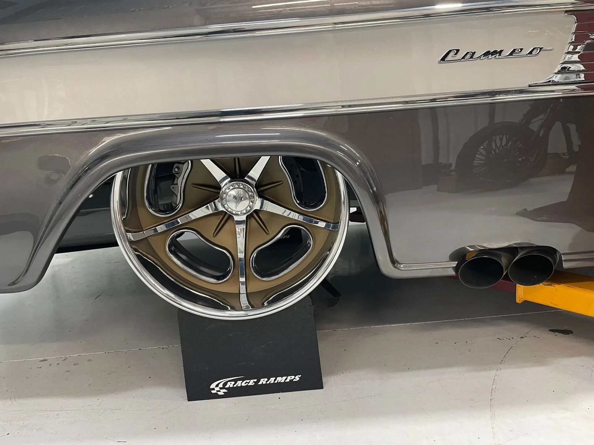 The word camaro is on the side of a car