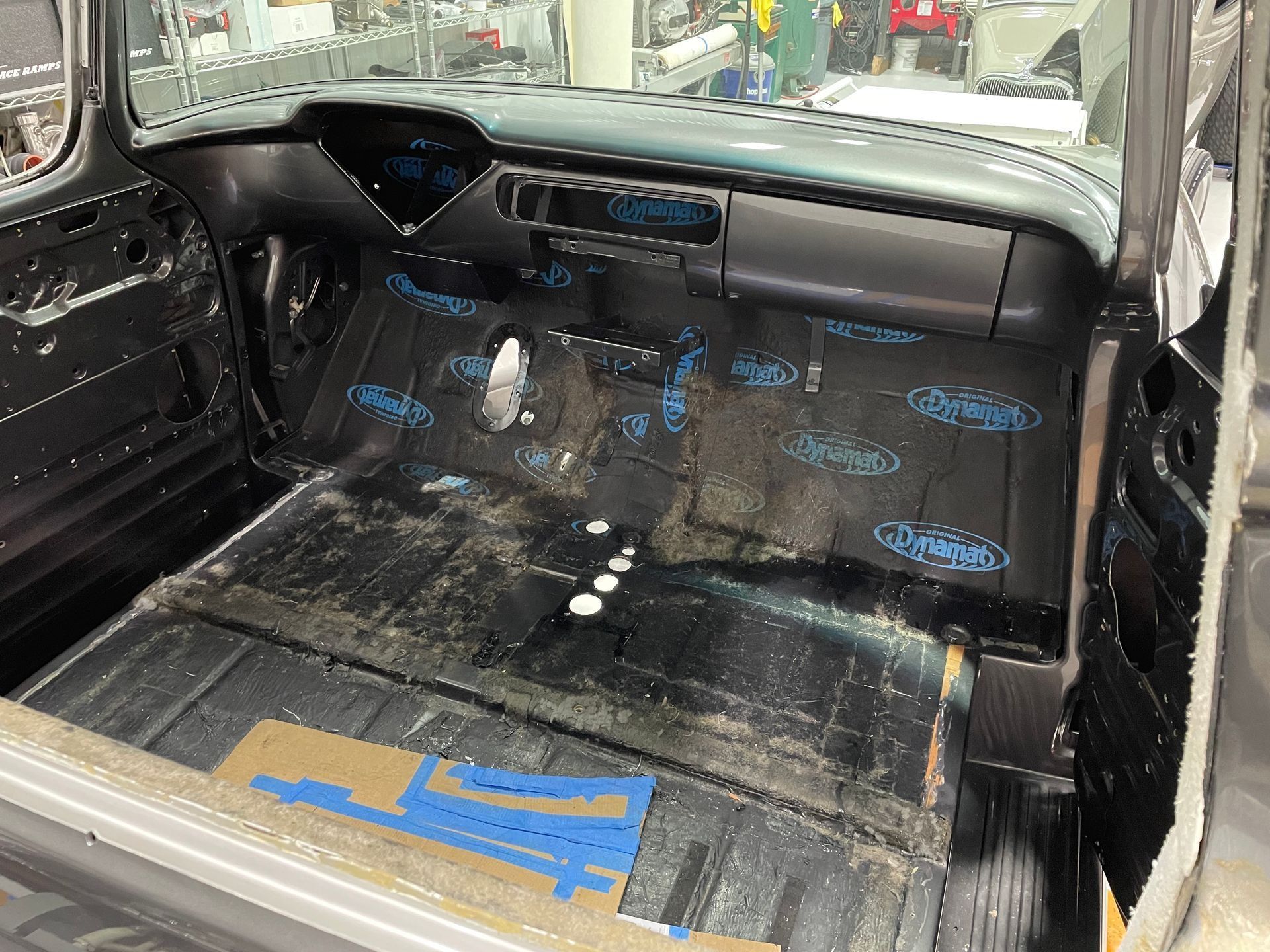 The interior of a car is being built in a factory.