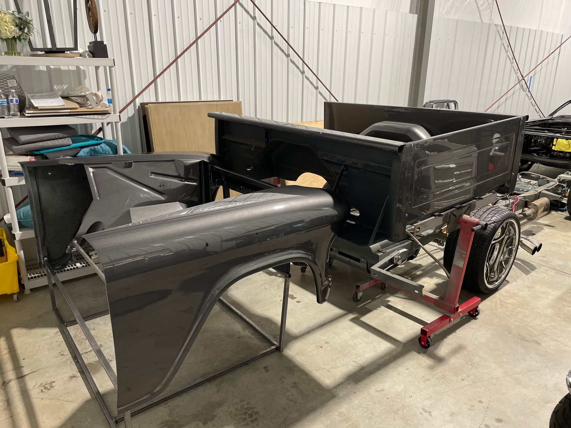 A truck body is being built in a garage.