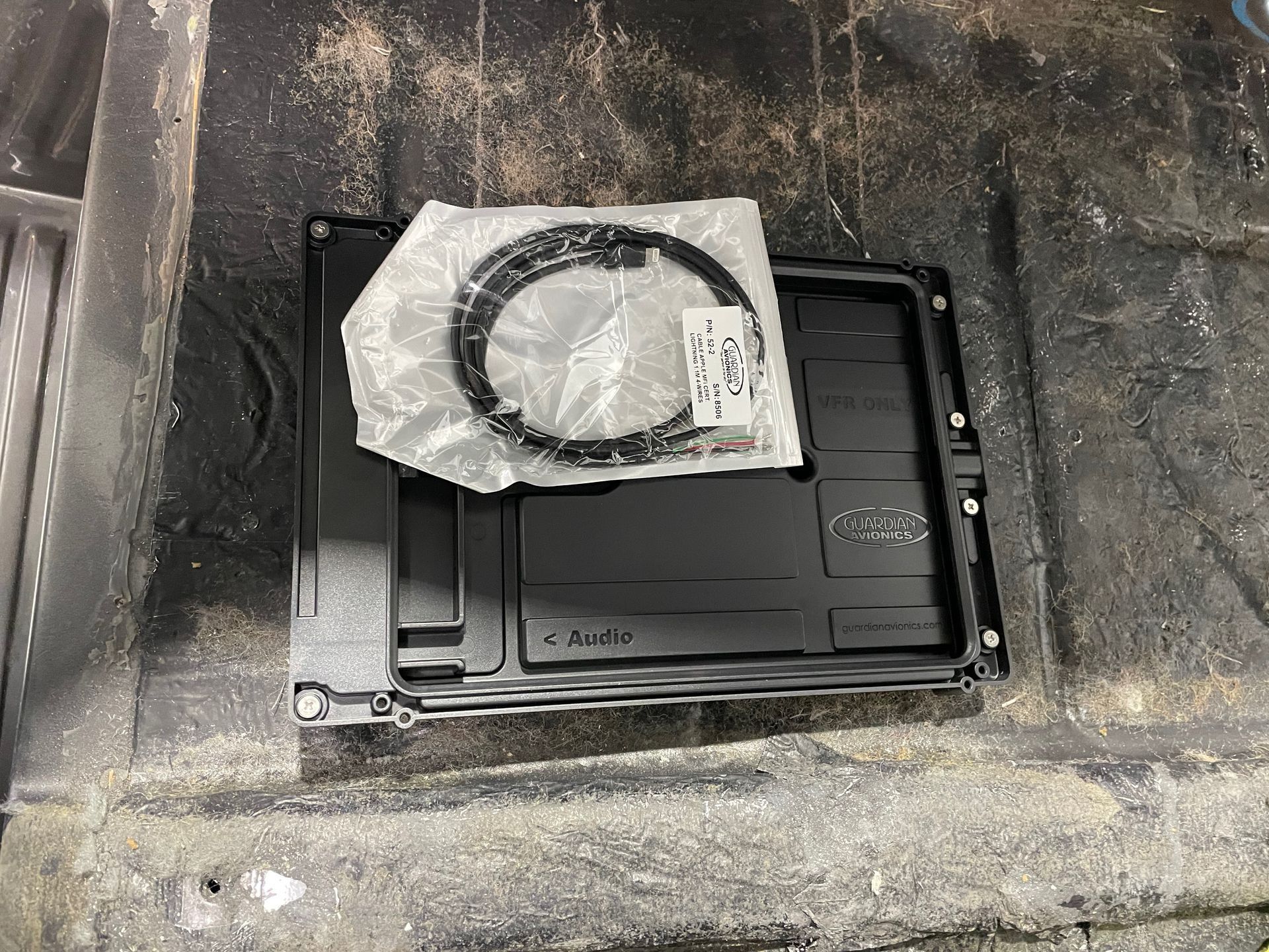 A black box with a ring on top of it.