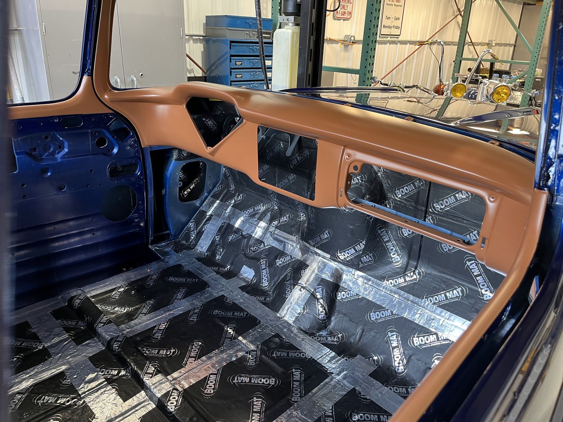 The inside of a car with a lot of insulation on the floor.