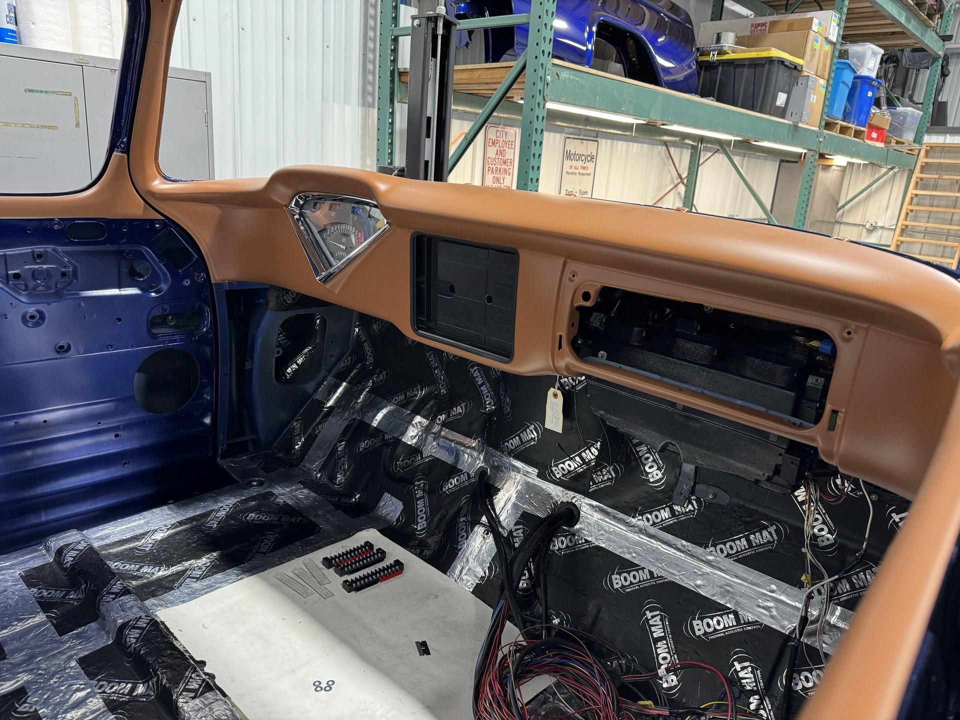 The interior of a blue truck is being remodeled.