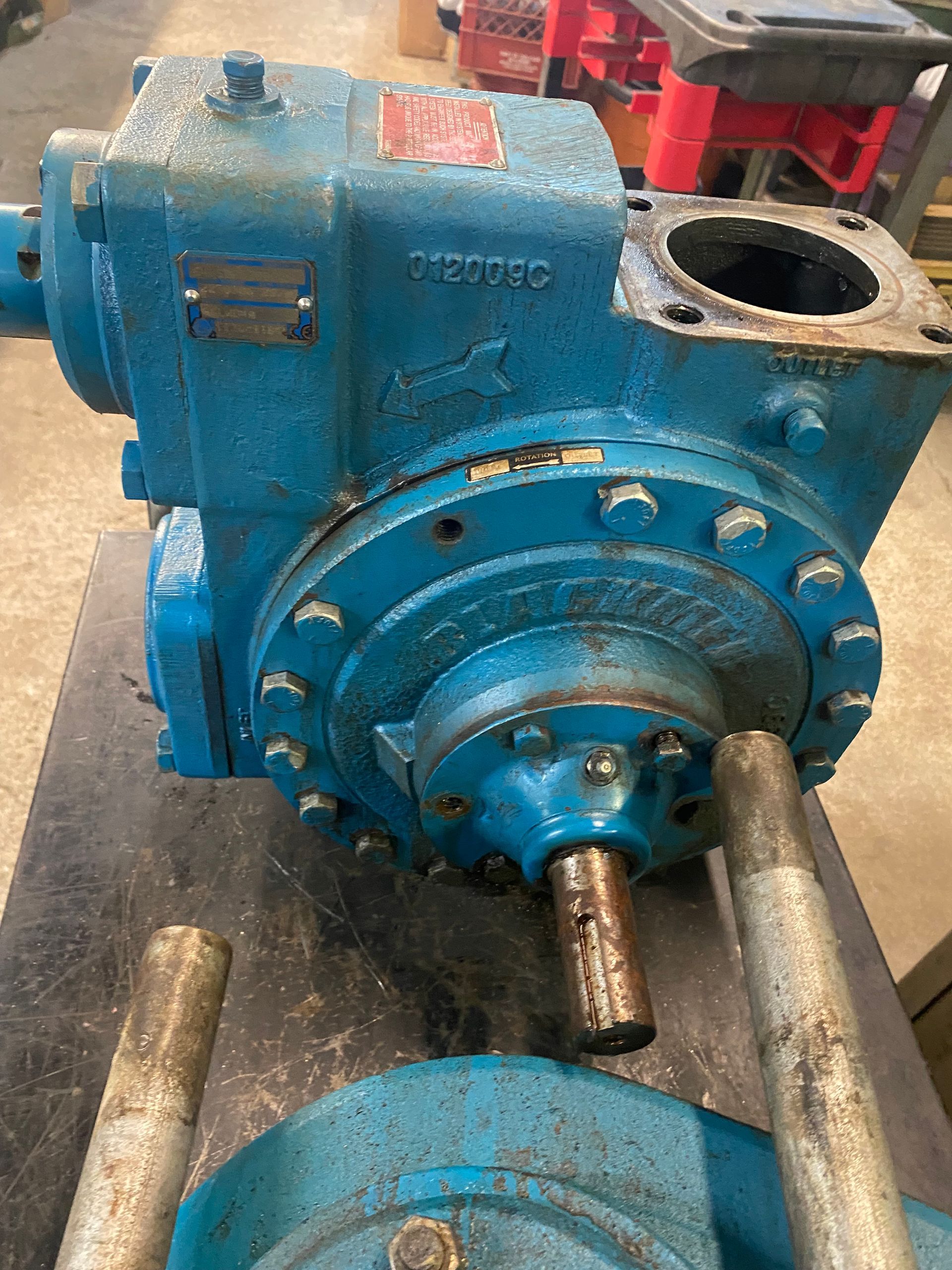 A blue pump is sitting on top of a table.