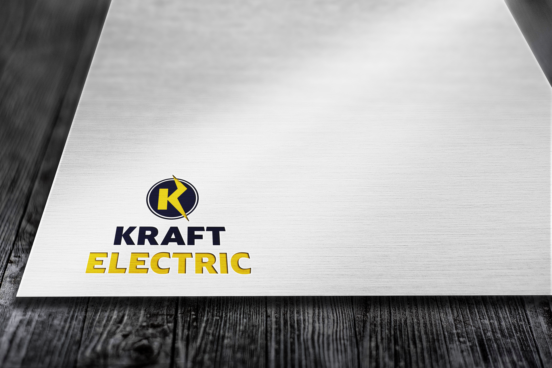 Kraft Electric logo on wood-grain paper; blue and yellow logo with text 