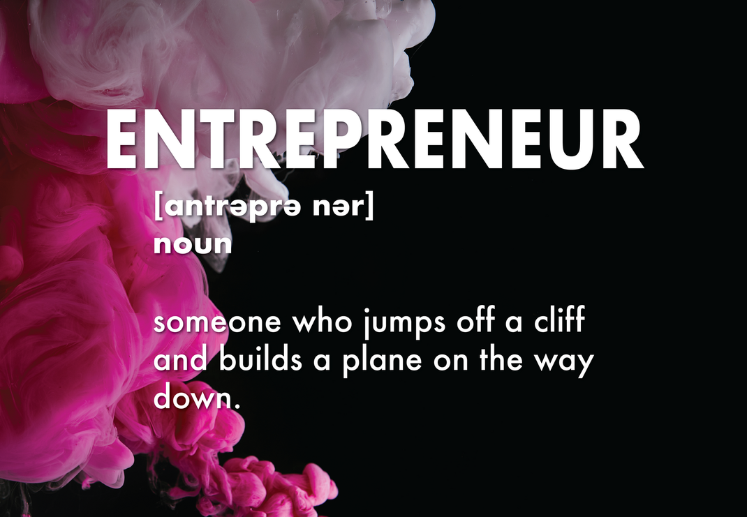 The word entrepreneur is on a black background with pink smoke in the background.