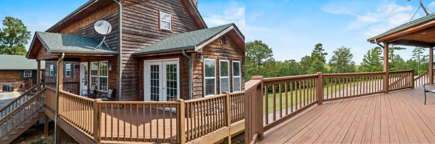 Wooden deck with railing beside a brick house with white-trimmed windows under a blue sky