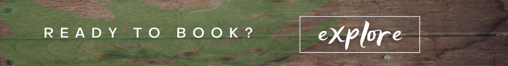 “Ready to book?” banner with white text and an “explore” button on a wood-textured background
