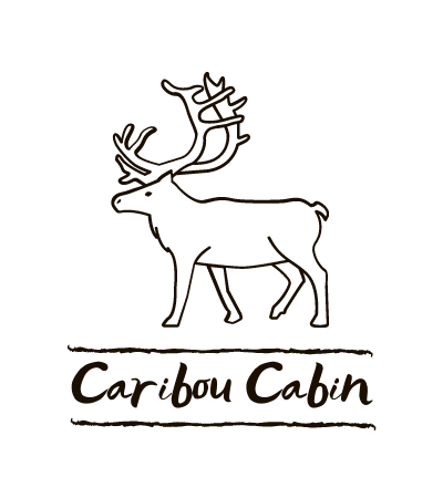 Black-and-white logo of a caribou above the words “Caribou Cabin”