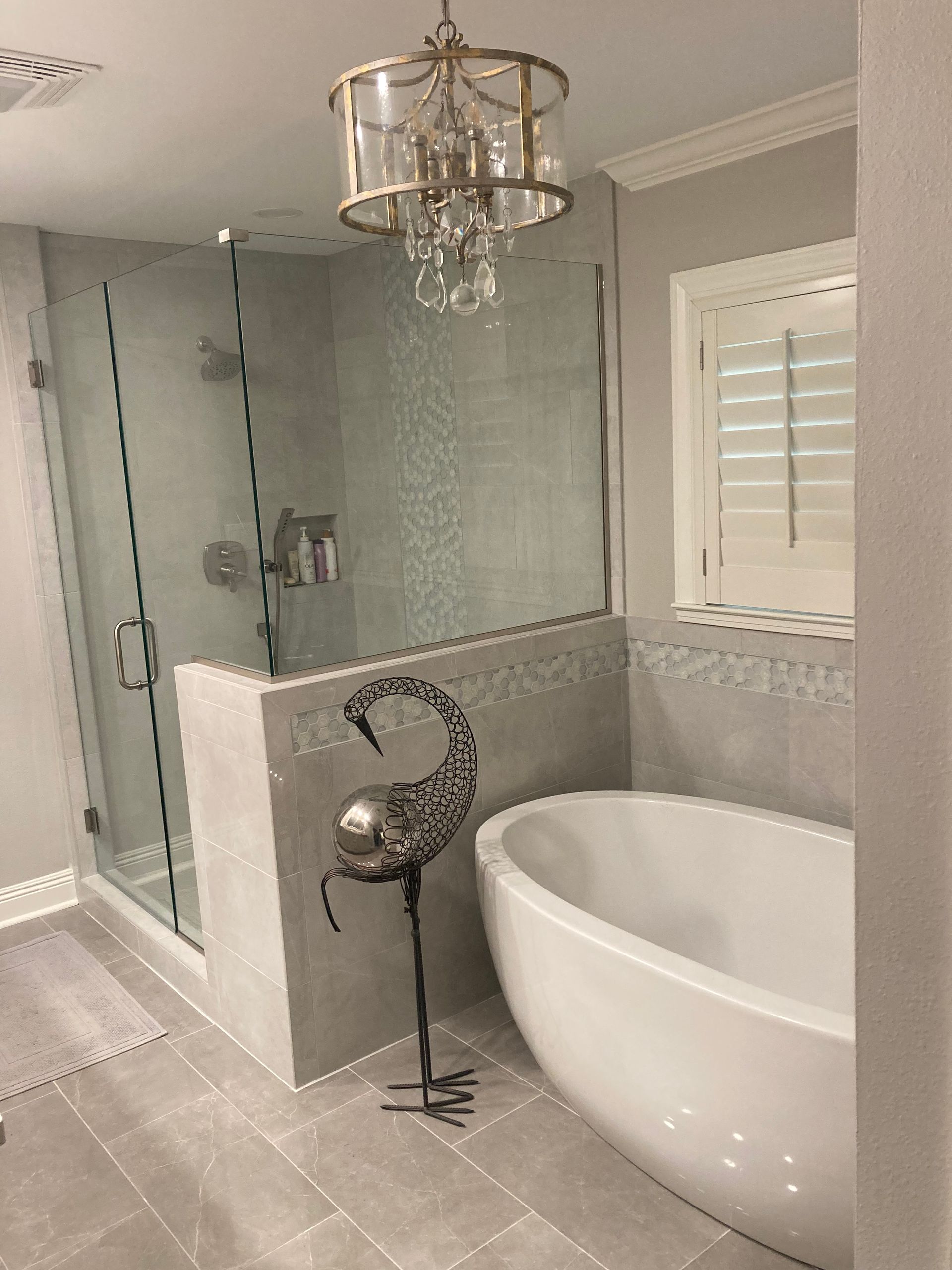 Steel-framed industrial building under construction; blue sky background.