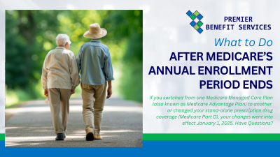 Two older people are walking down a path holding hands.