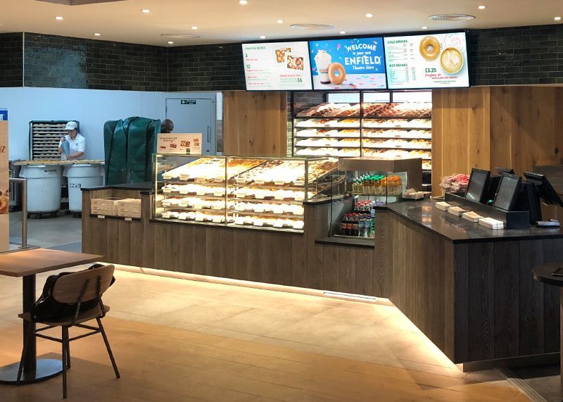 digital menu boards in a donut shop