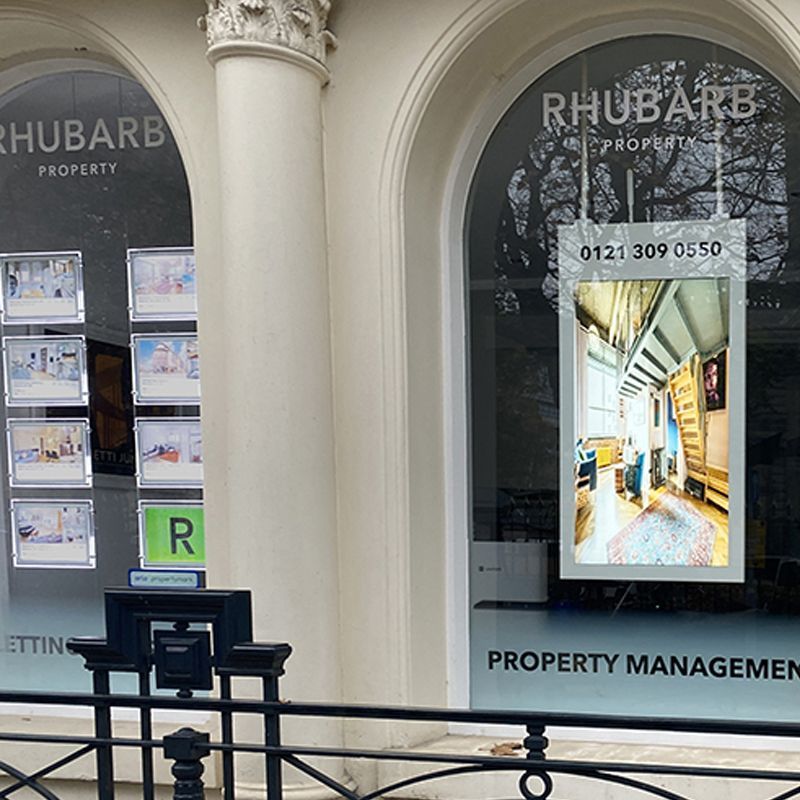 A window of a rhubarb property management company