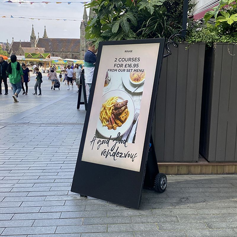 A sign with a picture of a plate of food on it