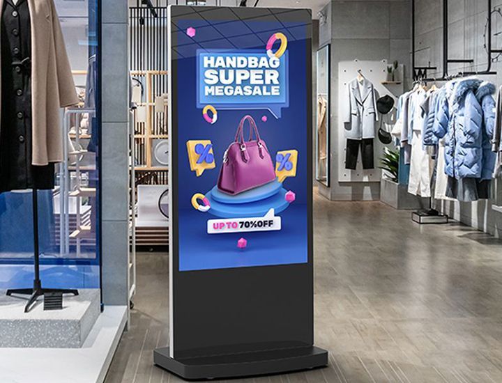 A digital sign in a clothing store advertising a handbag super mega sale.