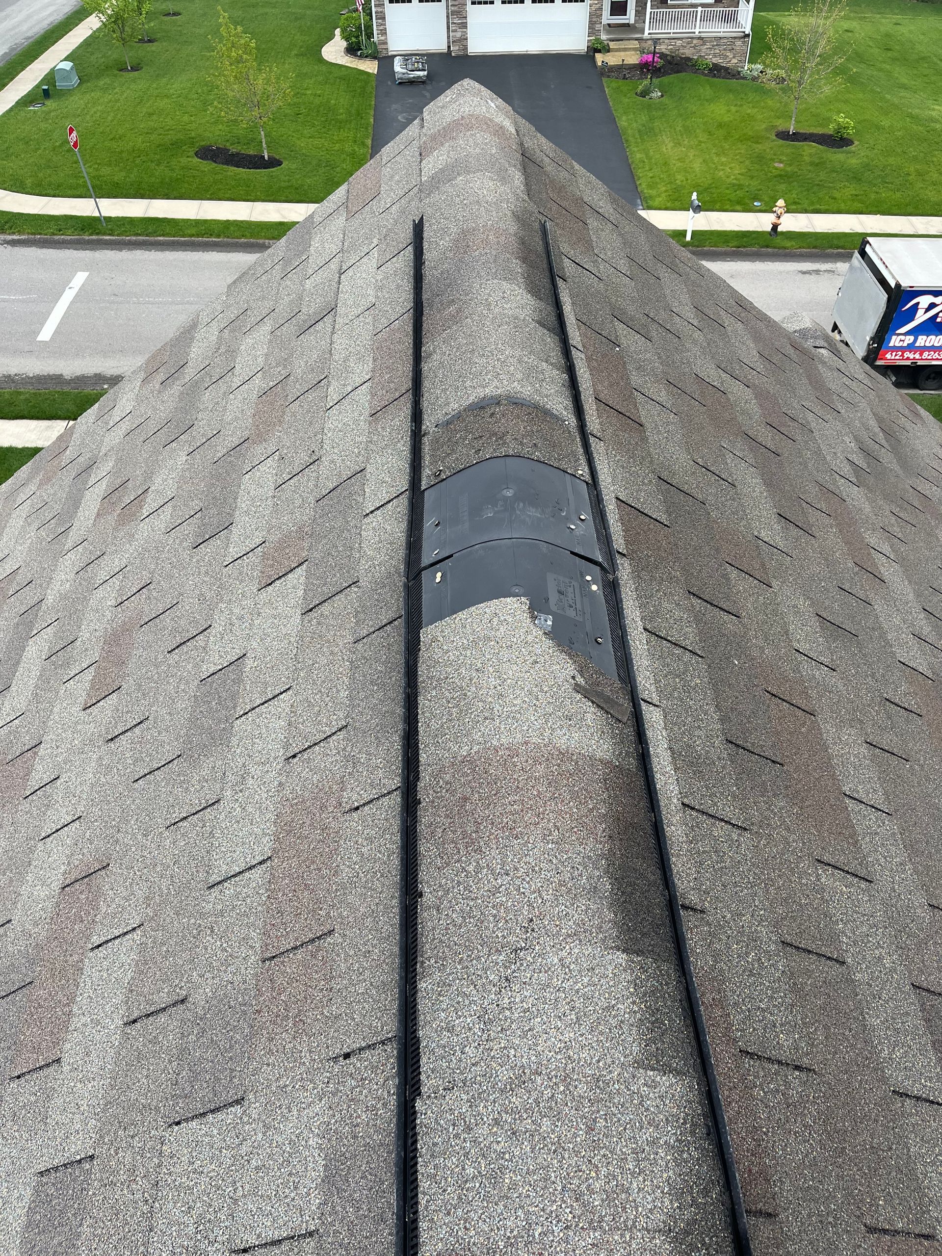 shingles missing on top of roof
