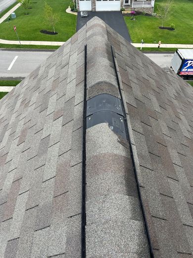 shingles missing  on top of roof 