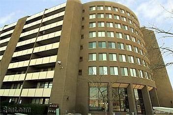 A large building with a lot of windows and balconies