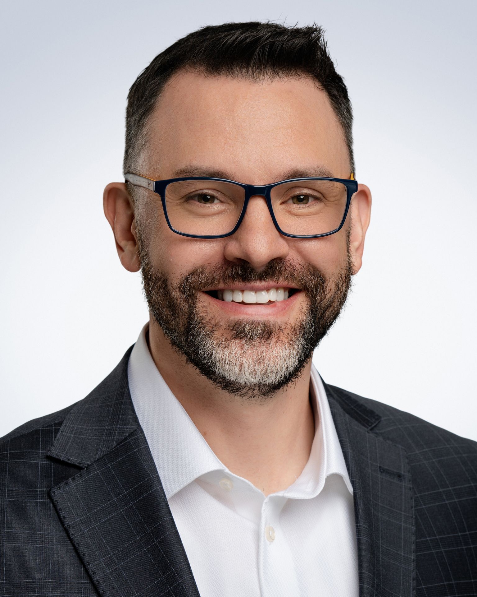 professional headshot of a professional wearing glasses.