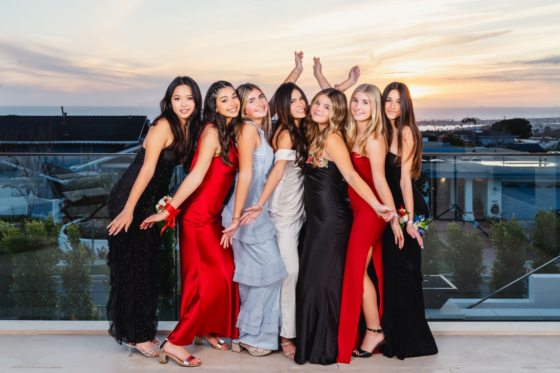A group of high school students posing during the school Winter Formal event.
