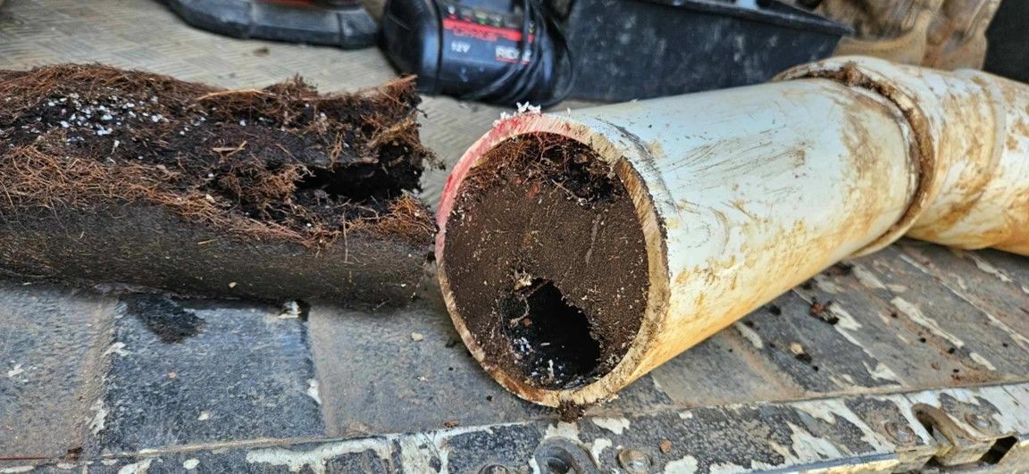 A close up of a pipe that has been cut in half.