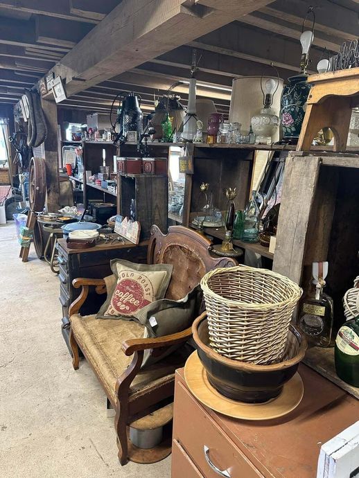 A room filled with lots of furniture and wicker baskets.