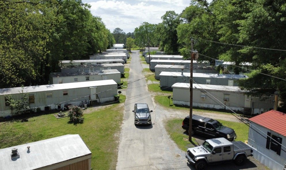 Mobile home community with shared road and homes