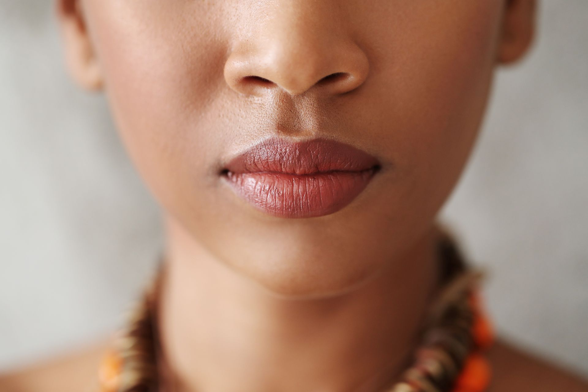 a close up of a woman 's lips and nose