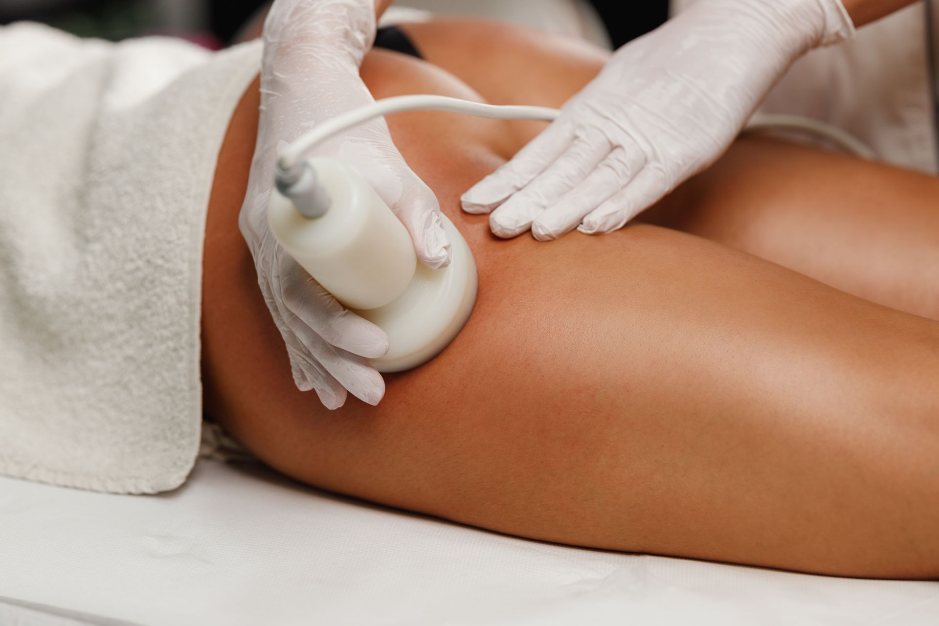 a woman is getting an ultrasound treatment on her leg