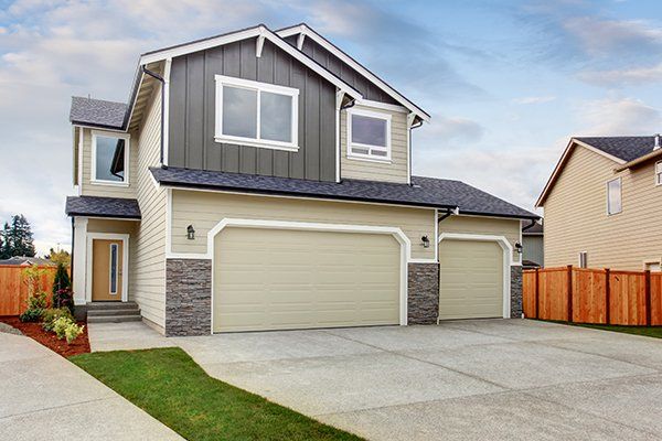 House Exterior with Two Garage Spaces — Pleasant Grove, AL — A Plus Garage Door