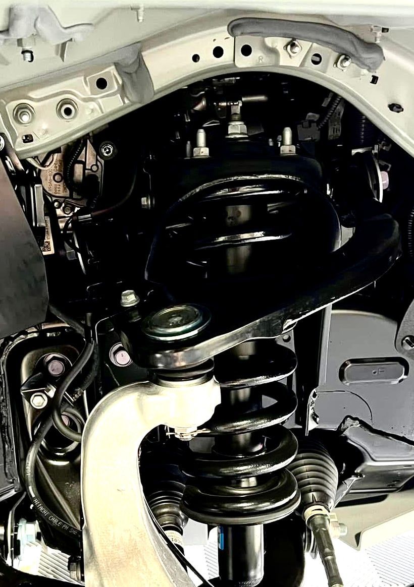 A blue car with black seats and a steering wheel