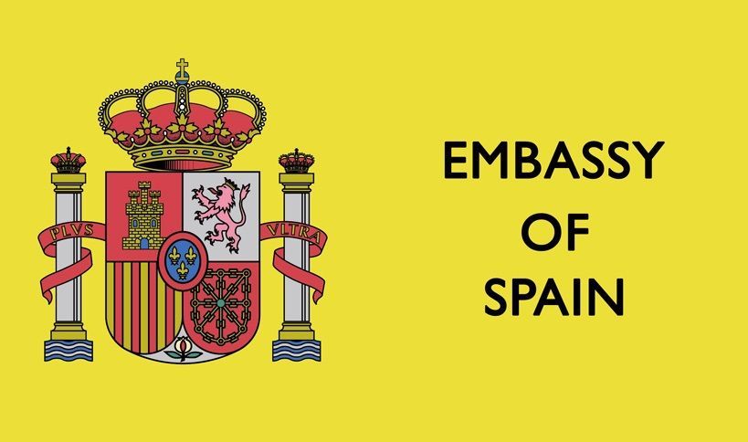 Embassy of Spain yellow logo.