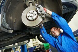 Mechanic Repairing Brakes